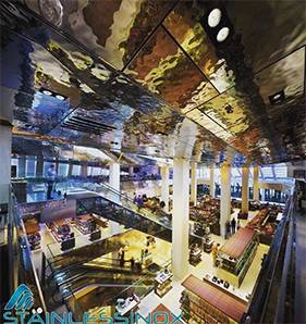 Spacious restaurant interior with high ceiling, elegant decor, and cozy ambiance