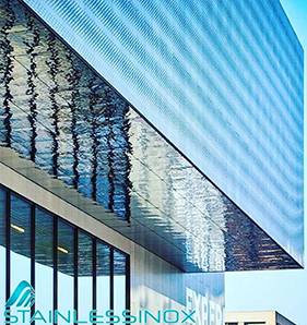 Spacious restaurant interior with high ceiling, elegant decor, and cozy ambiance