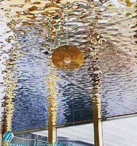 Spacious restaurant interior with high ceiling, elegant decor, and cozy ambiance