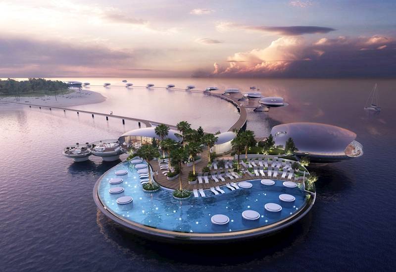 An underwater hotel with glass walls, floating in the ocean, surrounded by colorful marine life