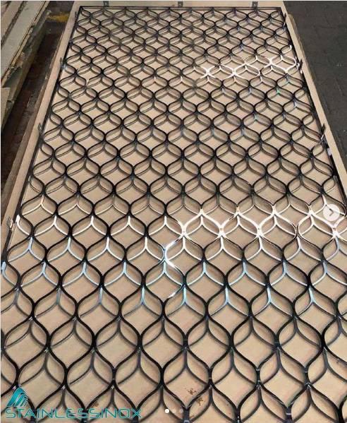 A metal mesh screen with an intricate pattern