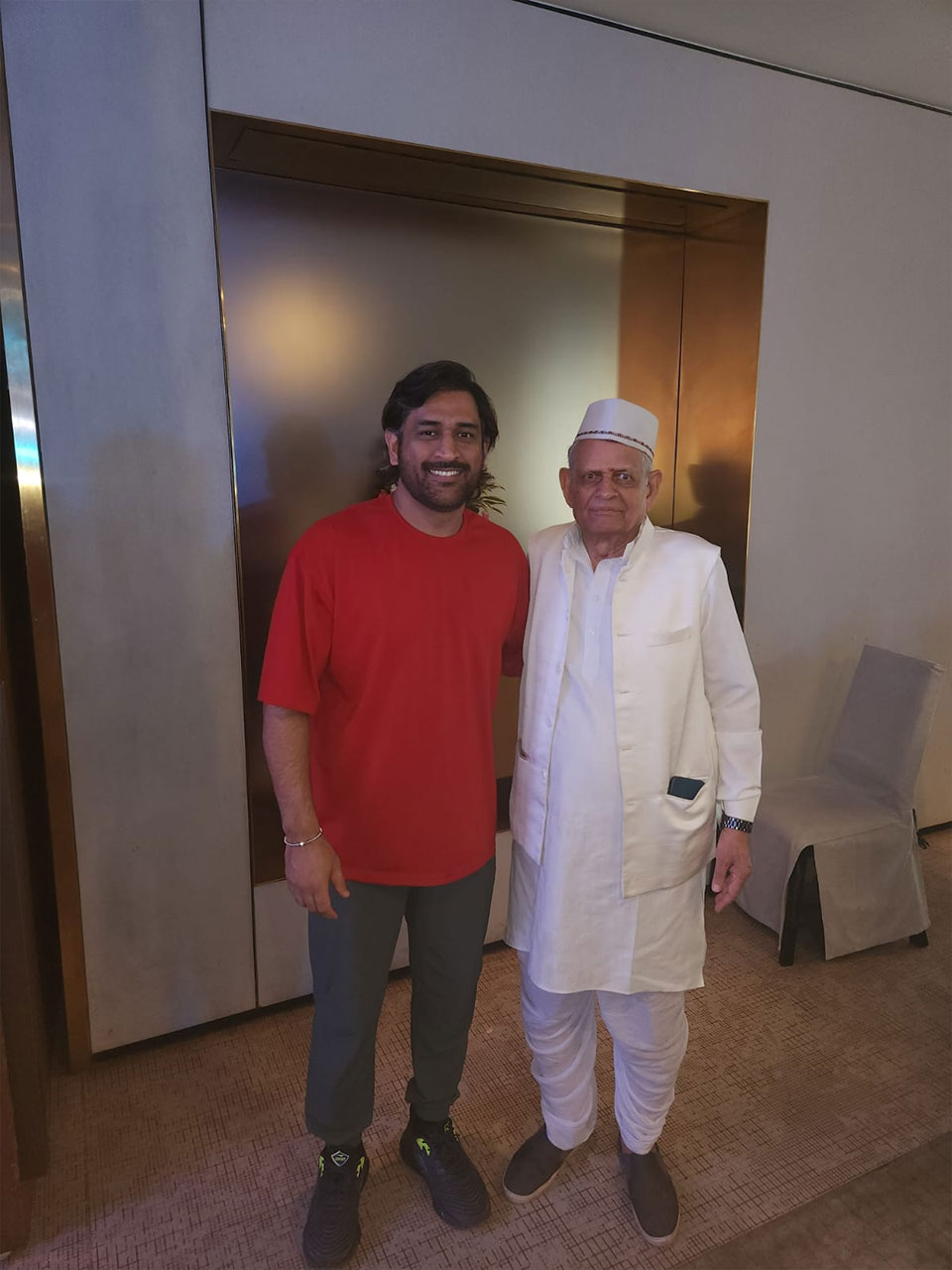 Two men stainding in a room