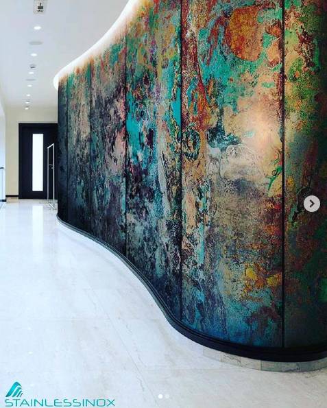 A vibrant mural adorns a massive wall, showcasing a burst of colors in an artistic display